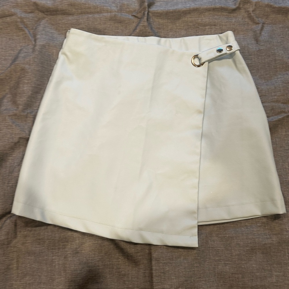 Francesca’s Faux leather, baby blue skirt.